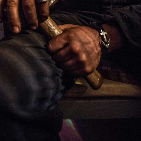 Neptune's Friend Anchor bracelet made from Neptune's Jewels, worn on a worker's wrist.