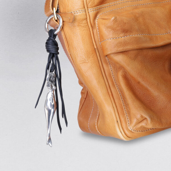 Gebamsel® pendant mermaid, detail view on a brown leather bag, pewter, from Neptune jewelry. Bag or key ring with snap hook, small.