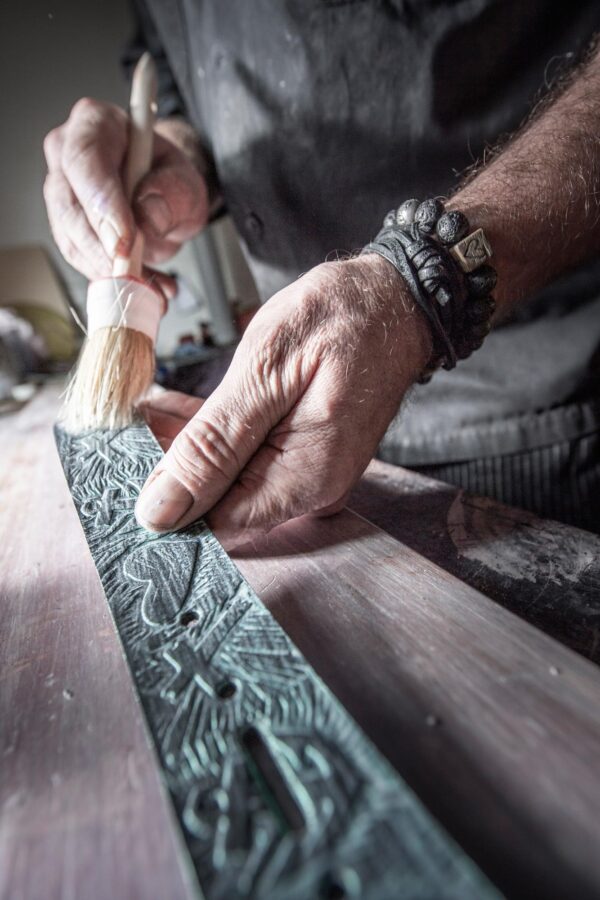 Neptune jewelry workshop. Detailed view of the dyeing of a leather strap for belt manufacture.