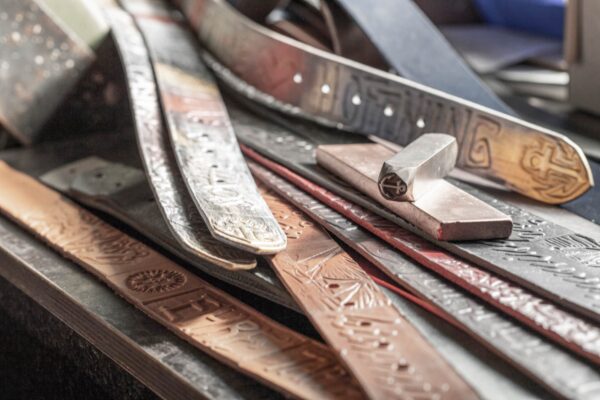 Neptune jewelry workshop and studio. Production of hand-embossed belt straps, embossing.