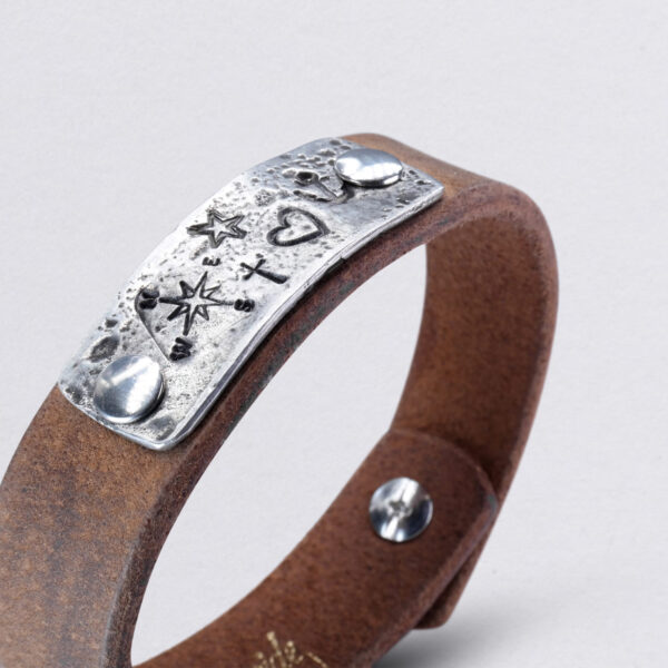 Leather bracelet with pewter and Faith Love Hope embossed symbols Dance of Neptune. detail picture.