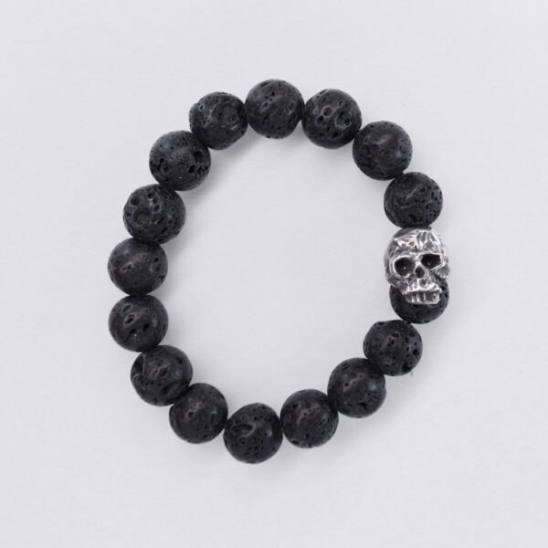 Bracelet lava beads with skull. Flexible bracelet and skull pewter bead. View from above.