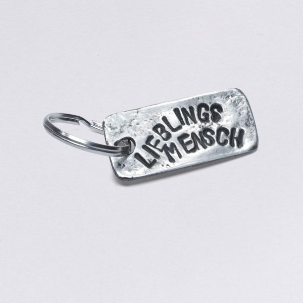 Key ring with favorite person embossing, pewter with inclusions, dimensions: approx. 2 x 4,5 cm, from Neptune jewelry. Customizable with desired embossing.